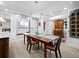 Spacious dining room with large windows and a unique antique cabinet at 1255 N Gulfstream Ave # 204, Sarasota, FL 34236