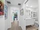 Clean hallway with light walls and hardwood floors at 1255 N Gulfstream Ave # 204, Sarasota, FL 34236