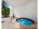 Relaxing circular hot tub with surrounding patio at 1255 N Gulfstream Ave # 204, Sarasota, FL 34236