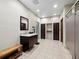 Clean locker room with sink, vanity and tiled floor at 1255 N Gulfstream Ave # 204, Sarasota, FL 34236