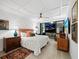 Main bedroom with a view of the ocean from a private balcony, and a coffered ceiling at 1255 N Gulfstream Ave # 204, Sarasota, FL 34236