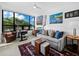 Spacious office with large window, desk, and comfortable couch at 1255 N Gulfstream Ave # 204, Sarasota, FL 34236