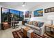 Bright office with large window, desk, and comfortable couch at 1255 N Gulfstream Ave # 204, Sarasota, FL 34236