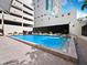 Inviting rectangular pool with surrounding patio and seating at 1255 N Gulfstream Ave # 204, Sarasota, FL 34236