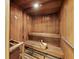Traditional wood-paneled sauna with benches and bucket at 1255 N Gulfstream Ave # 204, Sarasota, FL 34236