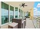 Spacious balcony with outdoor seating and a table to enjoy the amazing water views at 130 Riviera Dunes Way # 1104, Palmetto, FL 34221