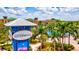 Scenic view of the Bradenton Riverwalk sign, multi-Gathering homes and lush palm trees at 130 Riviera Dunes Way # 1104, Palmetto, FL 34221