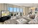 Open-concept living room featuring floor-to-ceiling windows with scenic views at 130 Riviera Dunes Way # 1104, Palmetto, FL 34221