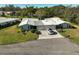 Aerial view of two-unit building with driveway and landscaping at 1312 Stafford Ln # 1427, Sarasota, FL 34232