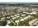 Wide aerial view of community, pool, and surrounding area at 1312 Stafford Ln # 1427, Sarasota, FL 34232