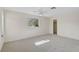 Bright bedroom with carpeted floor, ceiling fan, and a closet at 1312 Stafford Ln # 1427, Sarasota, FL 34232