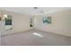 Bedroom with carpet, ceiling fan, and two windows at 1312 Stafford Ln # 1427, Sarasota, FL 34232