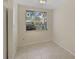 Cozy breakfast nook with tile flooring and a window overlooking the backyard at 1312 Stafford Ln # 1427, Sarasota, FL 34232