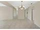 Dining room featuring tile floors and a beautiful chandelier at 1312 Stafford Ln # 1427, Sarasota, FL 34232