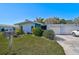 Single story home with attached two-car garage and well-maintained lawn at 1312 Stafford Ln # 1427, Sarasota, FL 34232