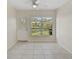 Room with tile floors, large window, and exterior access at 1312 Stafford Ln # 1427, Sarasota, FL 34232