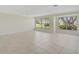 Bright and airy living room with tile flooring and large windows at 1312 Stafford Ln # 1427, Sarasota, FL 34232