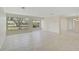 Living room with tile floors and large windows offering ample natural light at 1312 Stafford Ln # 1427, Sarasota, FL 34232