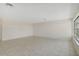 Living room with tile floor and large window at 1312 Stafford Ln # 1427, Sarasota, FL 34232