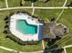 Community pool with surrounding patio and lounge chairs at 1312 Stafford Ln # 1427, Sarasota, FL 34232