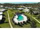 Aerial view of community pool and surrounding landscape at 1312 Stafford Ln # 1427, Sarasota, FL 34232