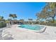 Community pool with surrounding patio and seating at 1312 Stafford Ln # 1427, Sarasota, FL 34232