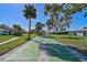Community shuffleboard court with surrounding landscaping at 1312 Stafford Ln # 1427, Sarasota, FL 34232