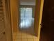 Condo entryway with tiled floor and access to living area at 13612 South Village Dr # 105, Tampa, FL 33618