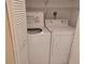 Condo laundry closet with washer and dryer at 13612 South Village Dr # 105, Tampa, FL 33618
