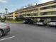 Condo parking lot with covered parking spaces at 13612 South Village Dr # 105, Tampa, FL 33618