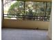 Condo screened balcony overlooking lush greenery at 13612 South Village Dr # 105, Tampa, FL 33618
