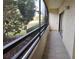 Long condo screened balcony with view of nature at 13612 South Village Dr # 105, Tampa, FL 33618