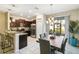 Kitchen and dining area with a large wooden table and a chandelier at 14339 Easy Goer St, Ruskin, FL 33573
