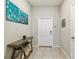 Bright entryway with a console table and neutral color scheme at 14339 Easy Goer St, Ruskin, FL 33573