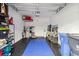 Well-organized garage with storage shelving and workbench at 14339 Easy Goer St, Ruskin, FL 33573