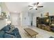 Open living room featuring a neutral color palette and fireplace at 14339 Easy Goer St, Ruskin, FL 33573