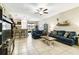 Spacious living room with a comfy sofa and a modern entertainment center at 14339 Easy Goer St, Ruskin, FL 33573