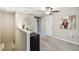 Spacious loft area with a mini fridge and carpeted flooring at 14339 Easy Goer St, Ruskin, FL 33573