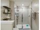 Clean and spacious shower with tiled walls and glass enclosure at 14339 Easy Goer St, Ruskin, FL 33573