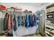 Large walk-in closet with ample hanging space and shelving at 14339 Easy Goer St, Ruskin, FL 33573