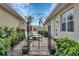 Charming courtyard with gate and lounge chairs at 150 Mestre Pl, North Venice, FL 34275