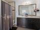 Bathroom with double vanity and shower/tub combo at 15404 Trinity Fall Way, Bradenton, FL 34212