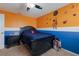 bedroom with space-themed wall decals and dark wood furniture at 15404 Trinity Fall Way, Bradenton, FL 34212