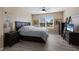 Primary bedroom with ample space and neutral colors at 15404 Trinity Fall Way, Bradenton, FL 34212