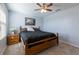 Spacious bedroom with wooden bed frame and nightstand at 15404 Trinity Fall Way, Bradenton, FL 34212