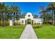Community entrance with stucco arch and landscaping at 15404 Trinity Fall Way, Bradenton, FL 34212