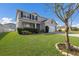 Two-story house with gray siding, white trim, and landscaping at 15404 Trinity Fall Way, Bradenton, FL 34212