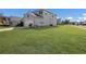 House exterior showcasing side view and grassy lawn at 15404 Trinity Fall Way, Bradenton, FL 34212
