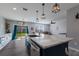 Open concept kitchen with a large island and quartz countertops at 15404 Trinity Fall Way, Bradenton, FL 34212