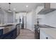 Modern kitchen with stainless steel appliances and a large island at 15404 Trinity Fall Way, Bradenton, FL 34212